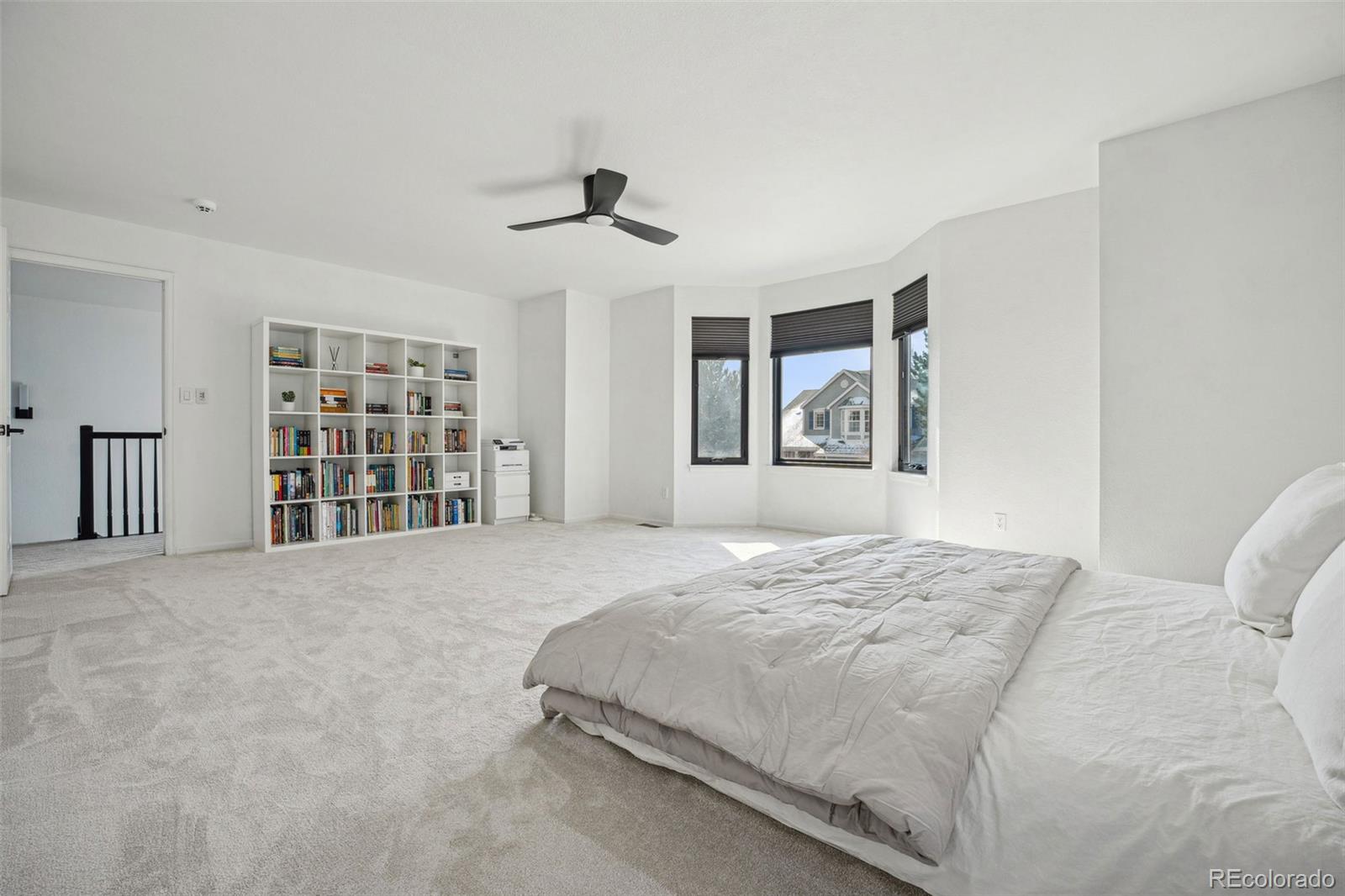 1711 Spring Water Lane Highlands Ranch, CO 80129 - Photo 26 of 48 a bedroom with a large bed closet and window