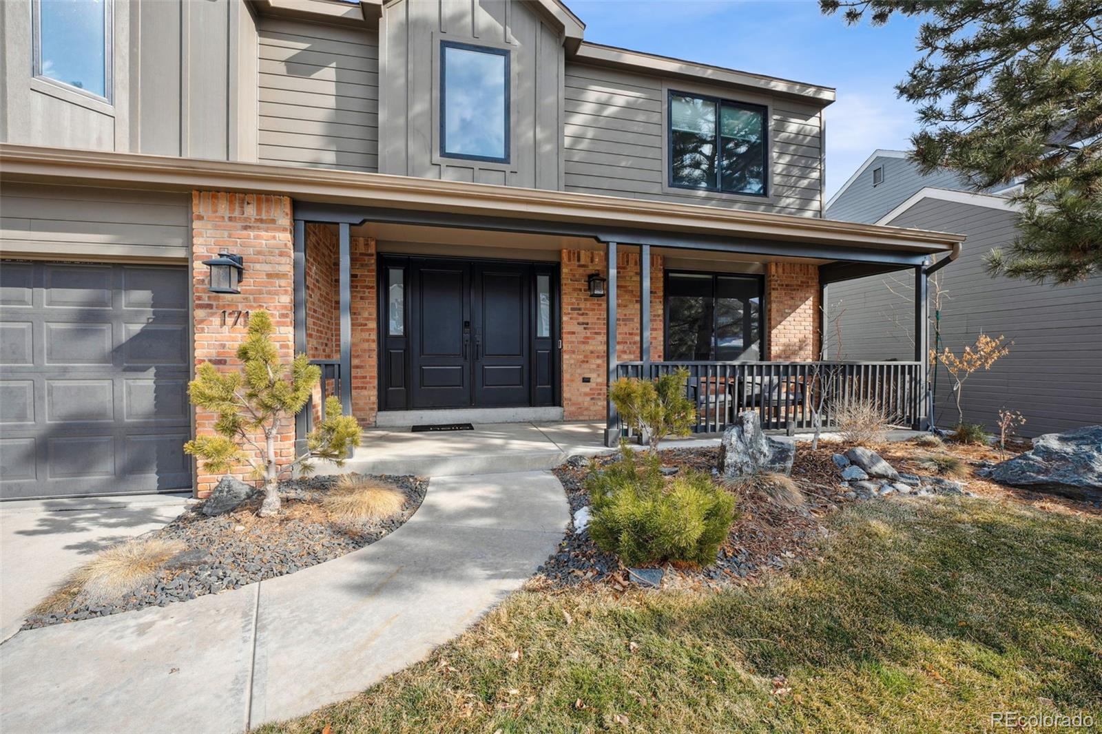 1711 Spring Water Lane Highlands Ranch, CO 80129 - Photo 3 of 48 a view of a house with backyard outdoor seating area and furniture