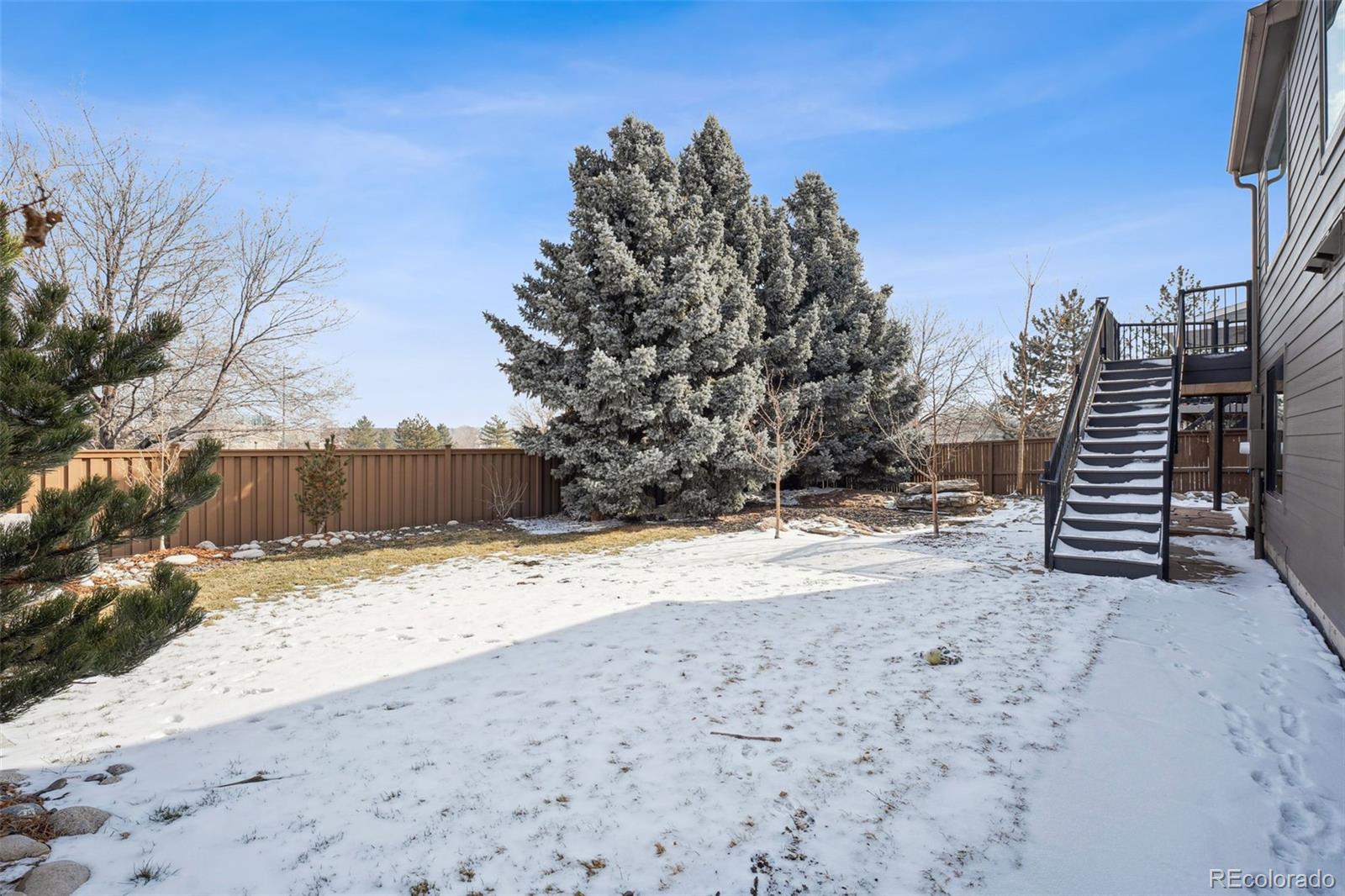 1711 Spring Water Lane Highlands Ranch, CO 80129 - Photo 41 of 48 a view of a yard with wooden fence