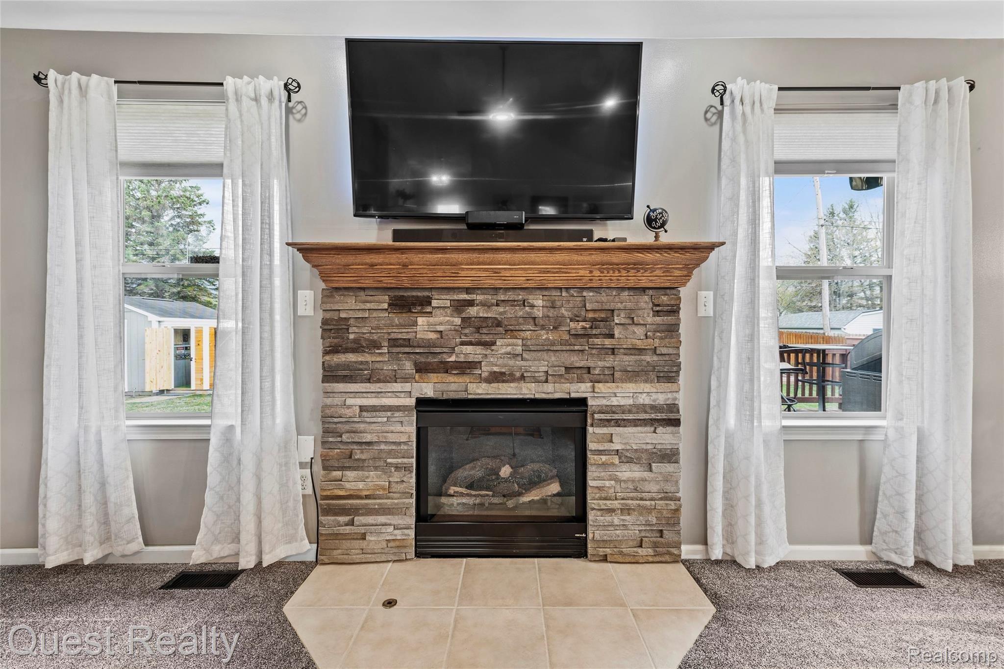 62 Rella Rae Avenue Marysville, MI 48040 - Photo 20 of 45 gas fireplace with newer stacked stone