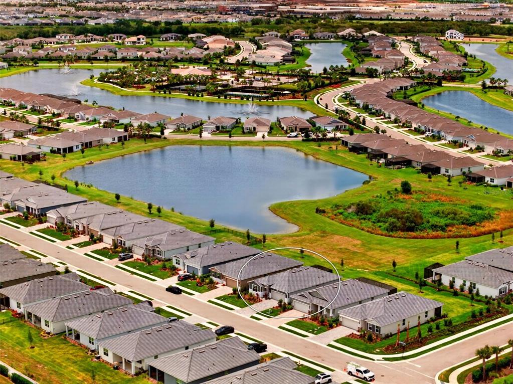 18237 Beach Ranch Terrace Bradenton, FL 34211 - Photo 59 of 72 an aerial view of residential houses with outdoor space