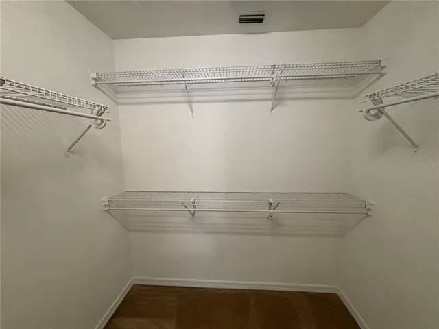 an empty room with wooden door