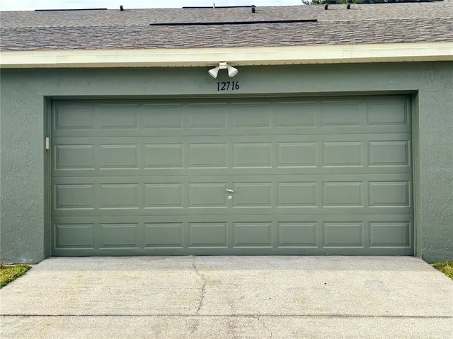a view of a swimming pool and chairs in patio