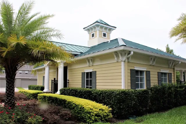 a body of water with a tree in the background