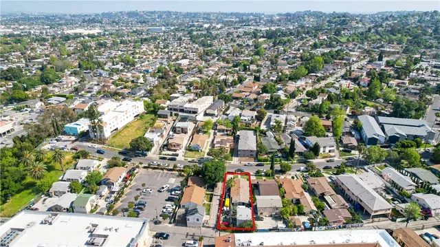 an aerial view of residential houses with outdoor space