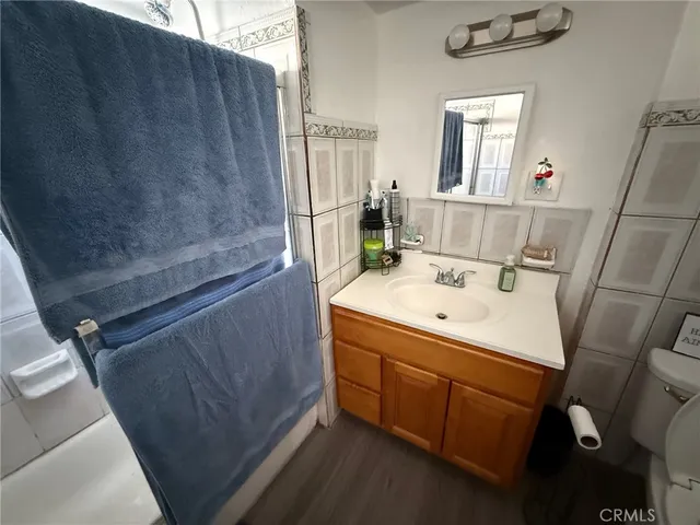 a bathroom with a sink a mirror and a shower