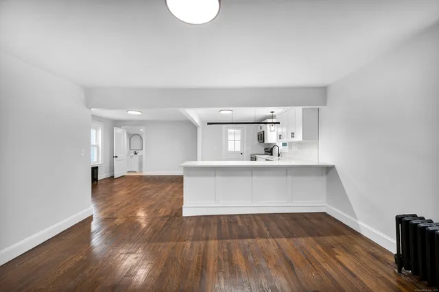 a view of kitchen and wooden floor