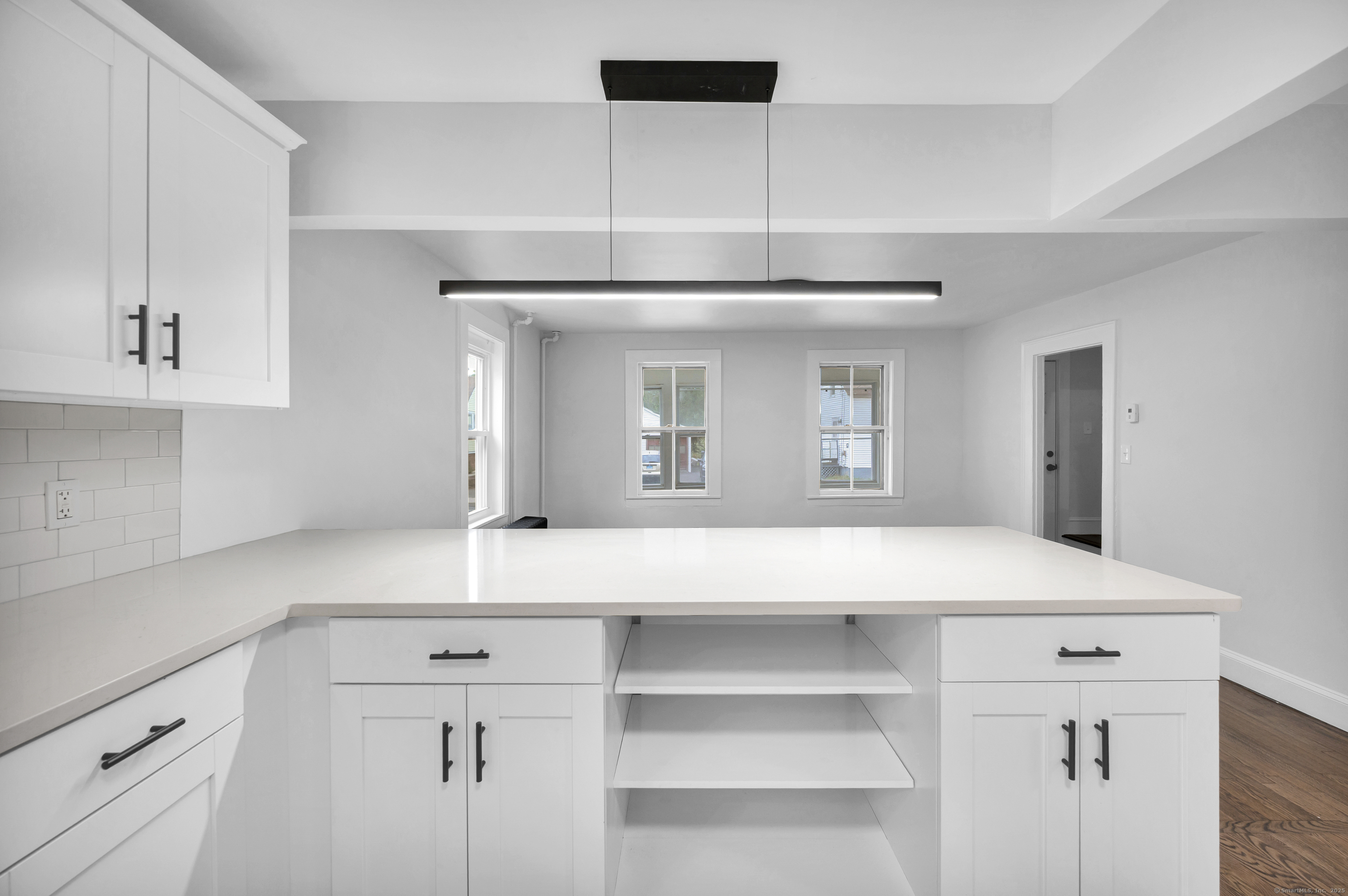 291 Main Street Cromwell, CT 06416 - Photo 16 of 38 a kitchen with a sink cabinets and wooden floor