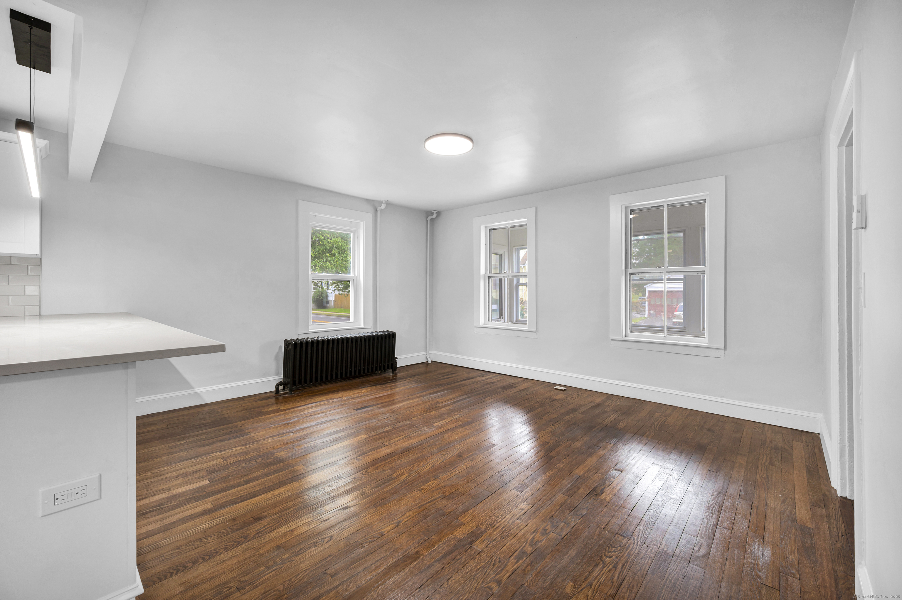 291 Main Street Cromwell, CT 06416 - Photo 17 of 38 a view of a room with wooden floor and a window