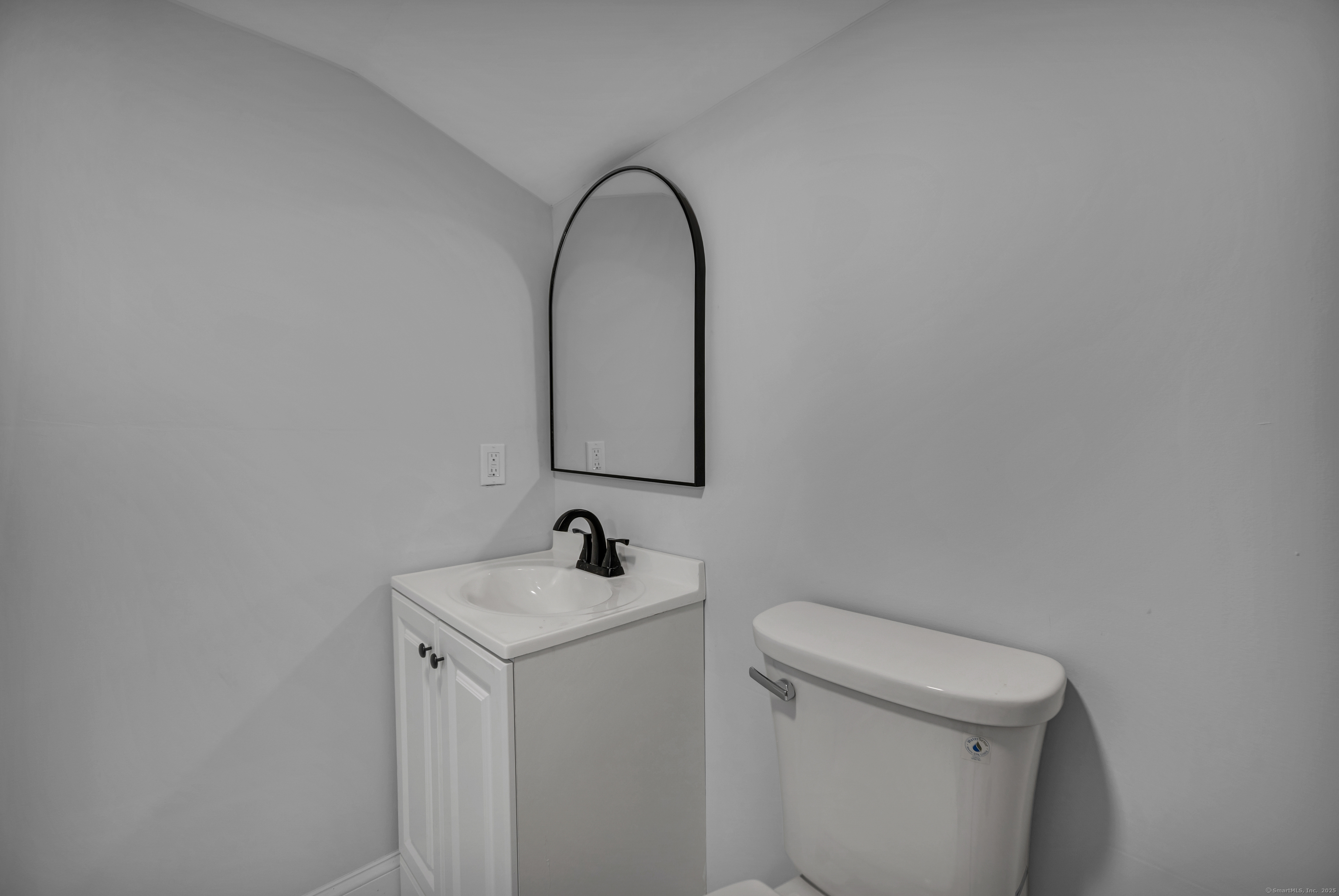 291 Main Street Cromwell, CT 06416 - Photo 23 of 38 a bathroom with a sink and a toilet