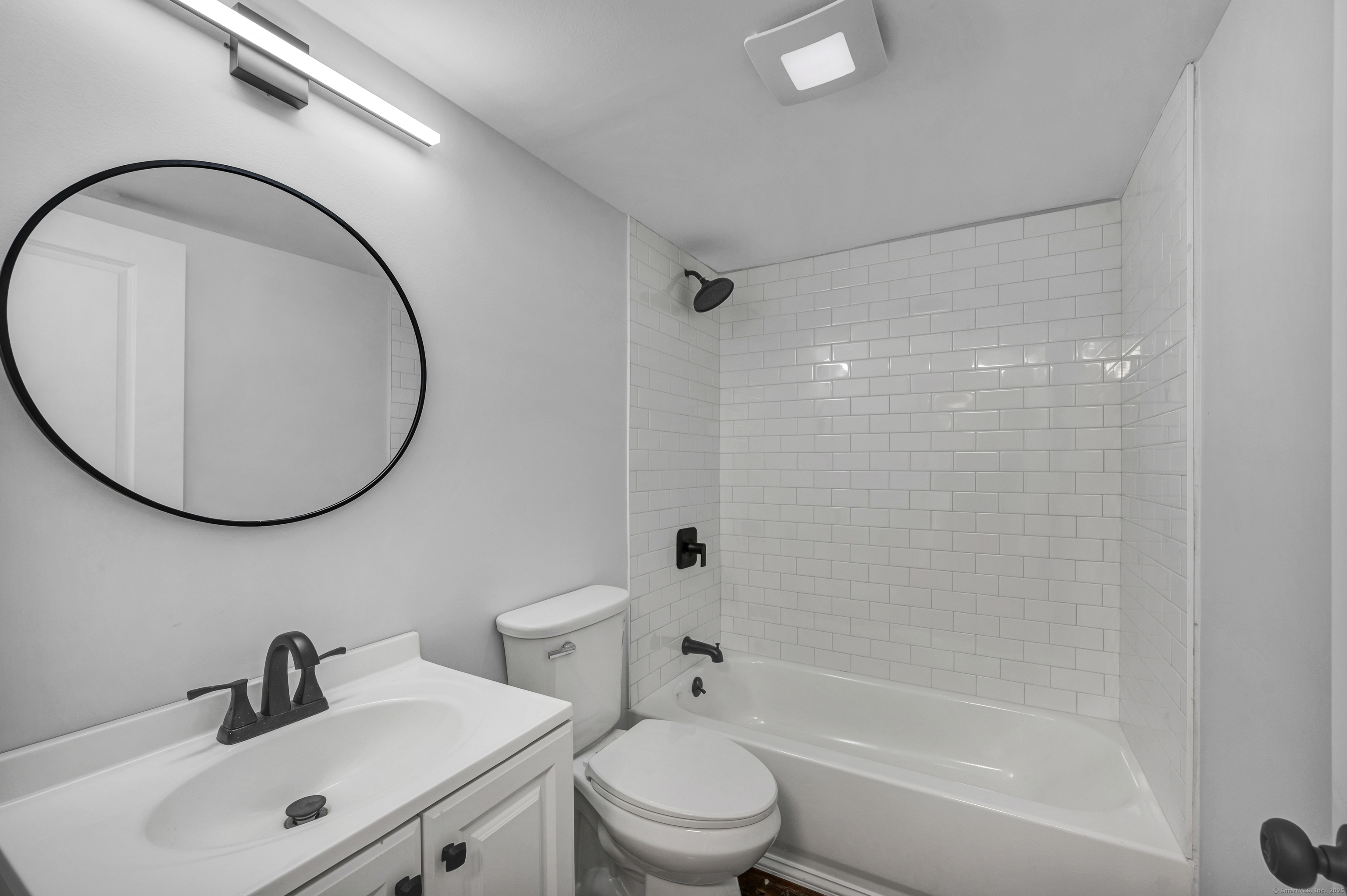 291 Main Street Cromwell, CT 06416 - Photo 34 of 38 a bathroom with a sink a toilet and a mirror