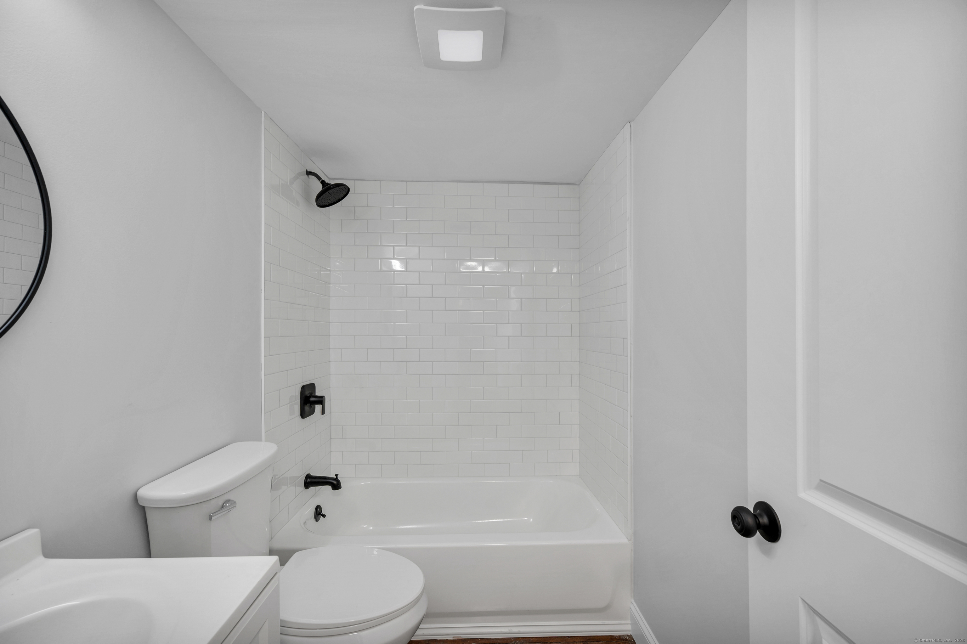 291 Main Street Cromwell, CT 06416 - Photo 35 of 38 a white toilet sitting next to a bath tub