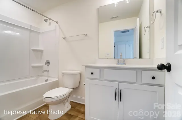 a bathroom with a sink toilet a shower and bathtub