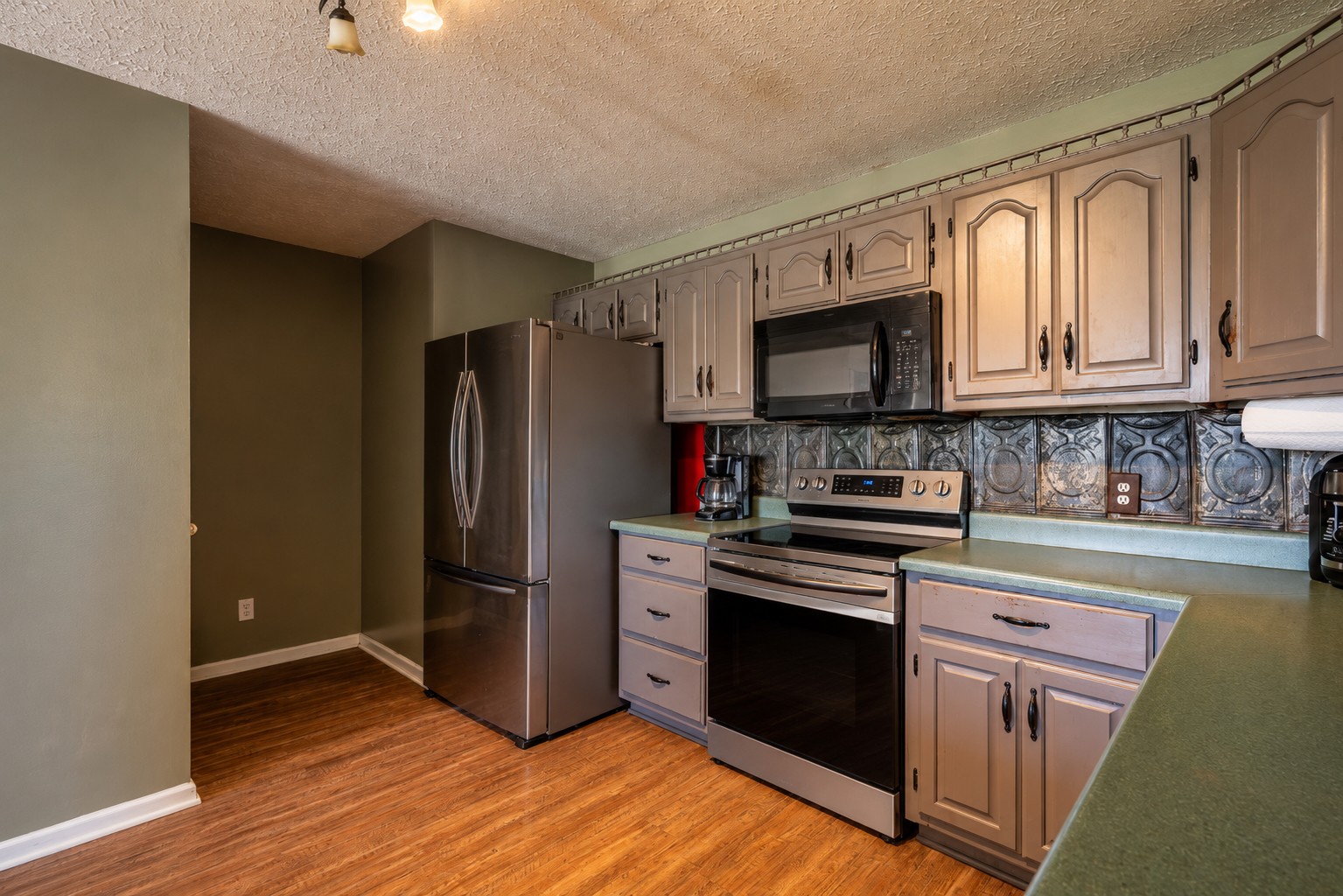 11220 Shelbyville Road Morrison, TN 37357 - Photo 13 of 67 a kitchen with granite countertop a refrigerator stove and sink