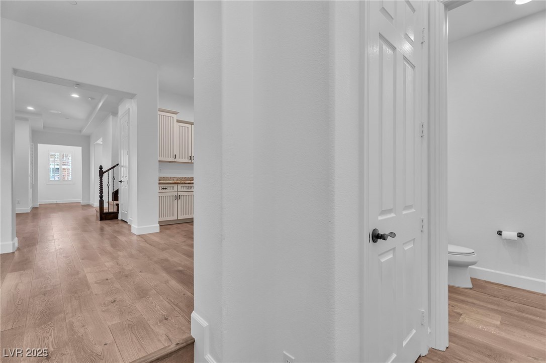 11280 Granite Ridge Drive, Unit 1037 Las Vegas, NV 89135 - Photo 23 of 62 Entry from the garage, powder room, closet, Kitchen on the right.