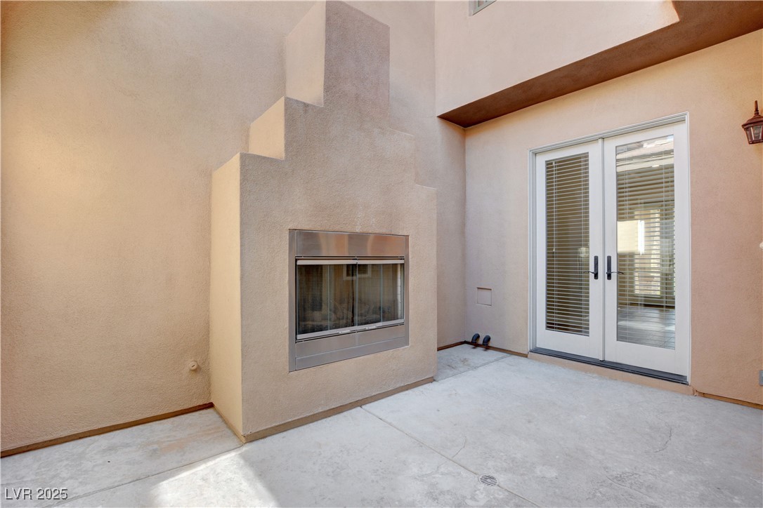 11280 Granite Ridge Drive, Unit 1037 Las Vegas, NV 89135 - Photo 53 of 62 Central courtyard with fireplace