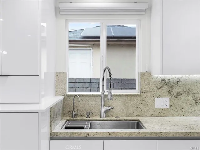 a close view of a utility room with washer and dryer