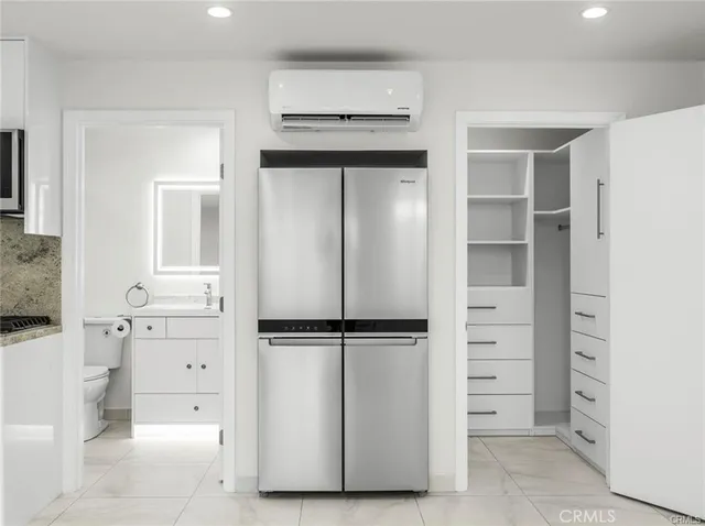 a bathroom with a mirror sink and vanity