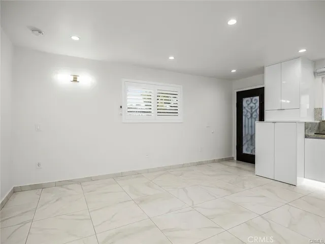 a kitchen with stainless steel appliances granite countertop a sink and a stove