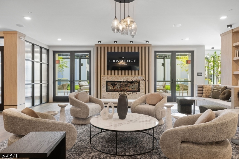 169 Johnson Road Morris Plains, NJ 07950 - Photo 6 of 13 a living room with furniture a fireplace and a chandelier