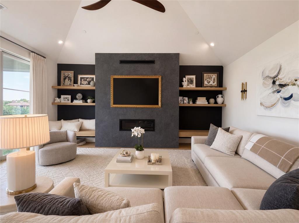 320 O Connor Ridge Boulevard, Unit 22 Irving, TX 75038 - Photo 10 of 34 a living room with fireplace furniture and a flat screen tv