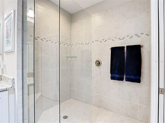 a bathroom with a shower and a sink
