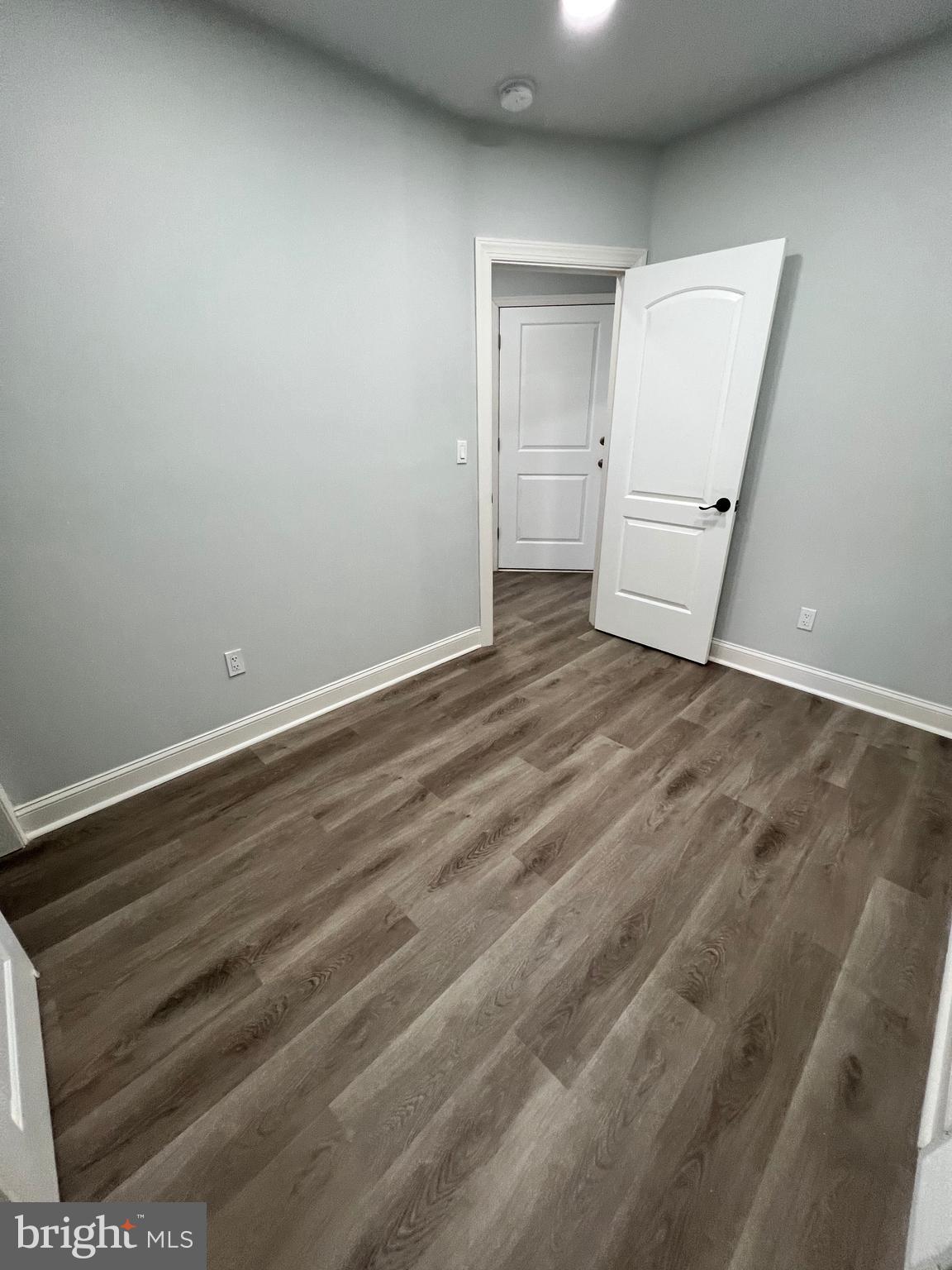 1705 South 18th Street, Unit 1 Philadelphia, PA 19145 - Photo 11 of 18 a view of room with window and wooden floor