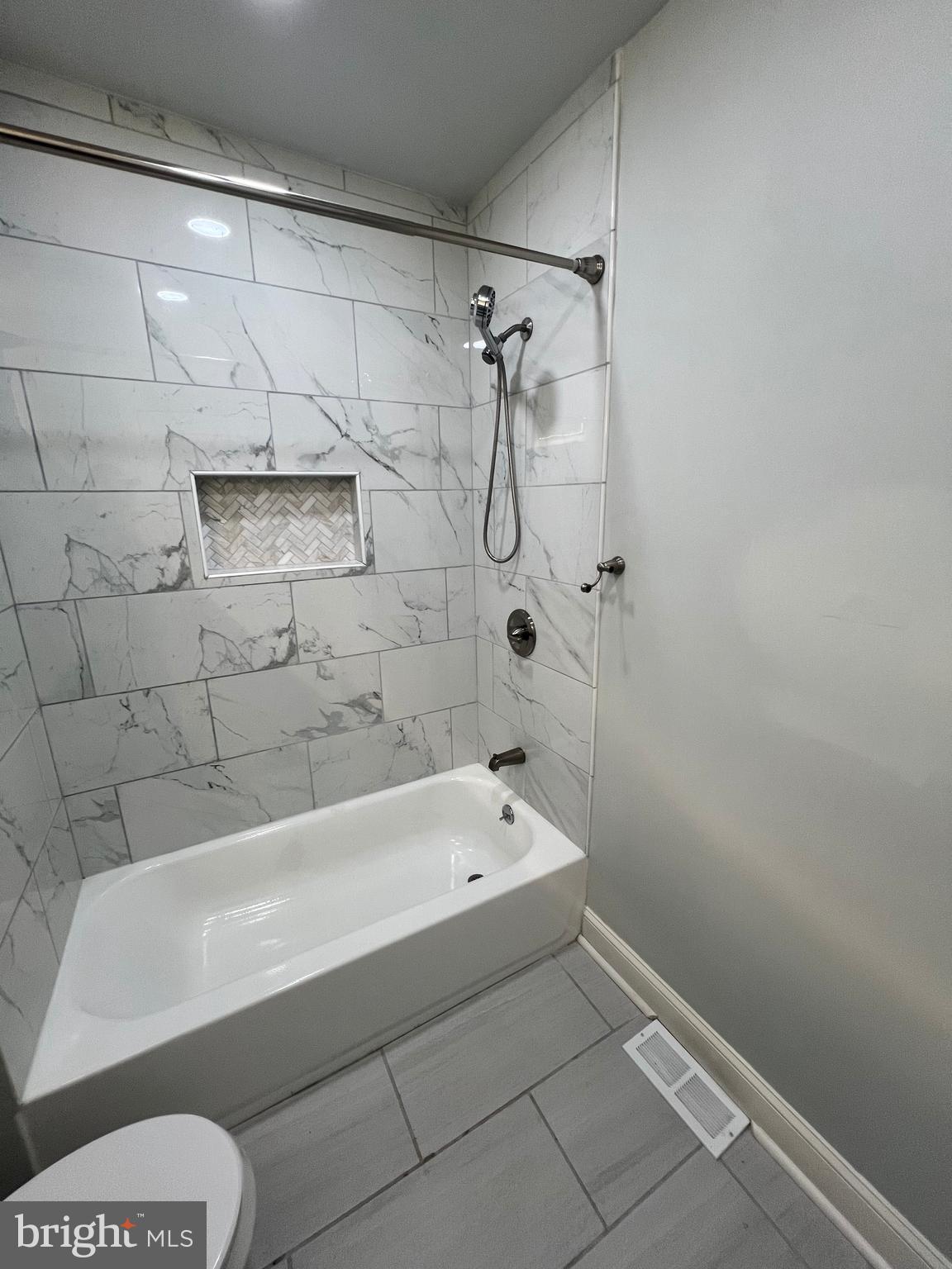 1705 South 18th Street, Unit 1 Philadelphia, PA 19145 - Photo 14 of 18 a bathroom with a bathtub and a shower