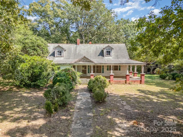 a front view of a house with yard