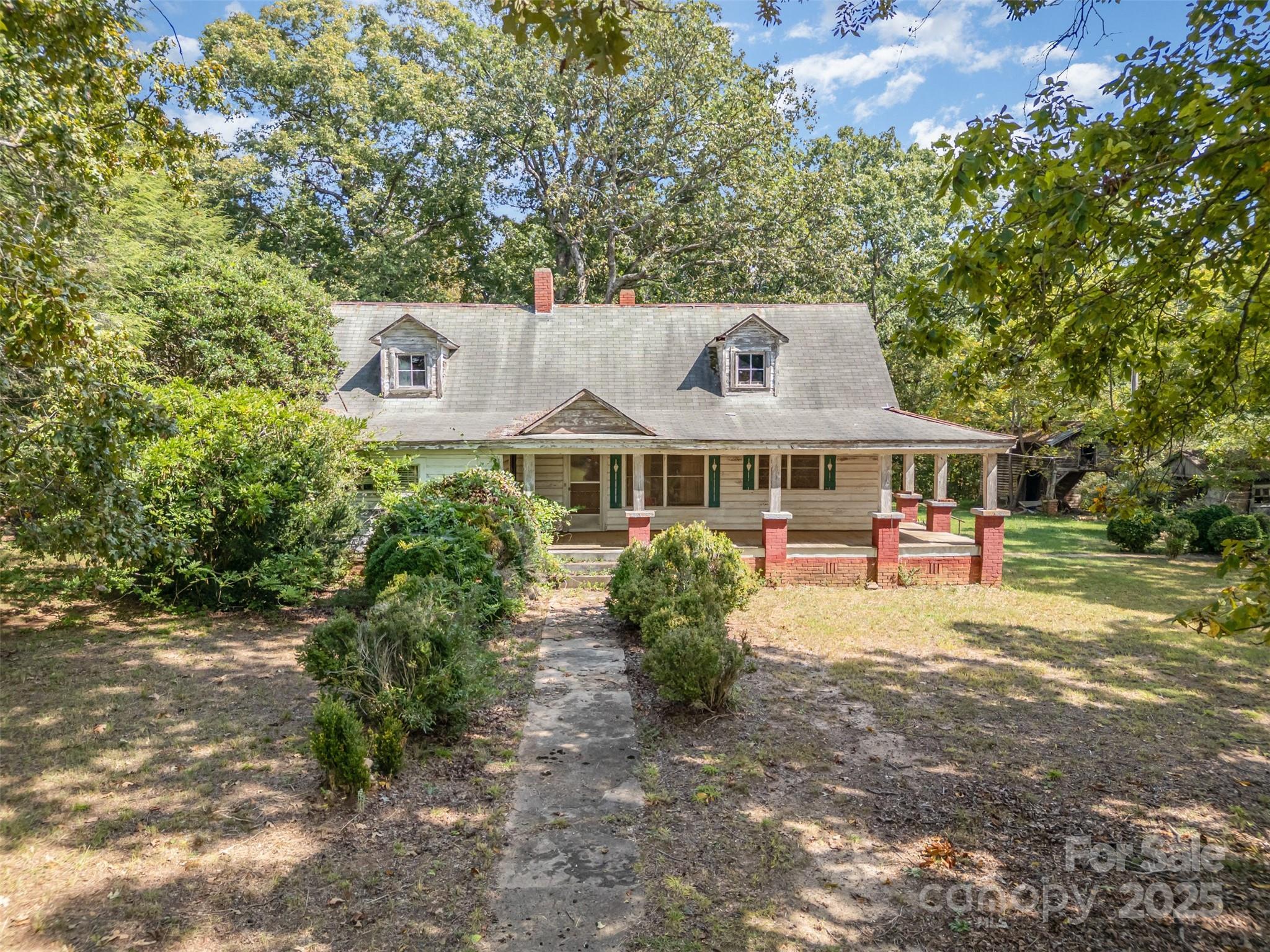 a front view of a house with yard