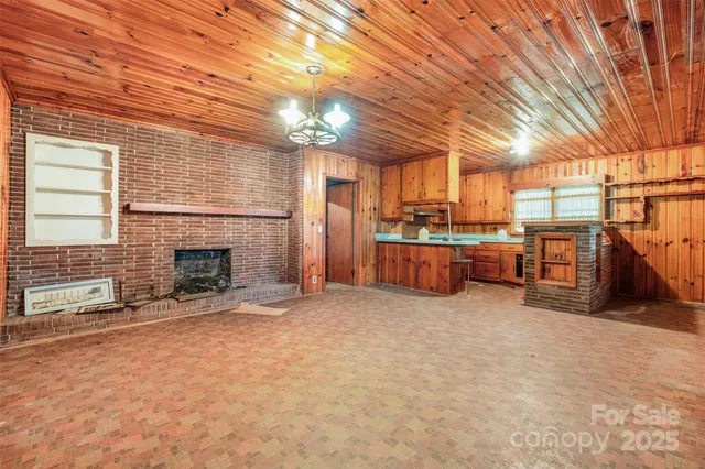 a view of a room with furniture and a kitchen