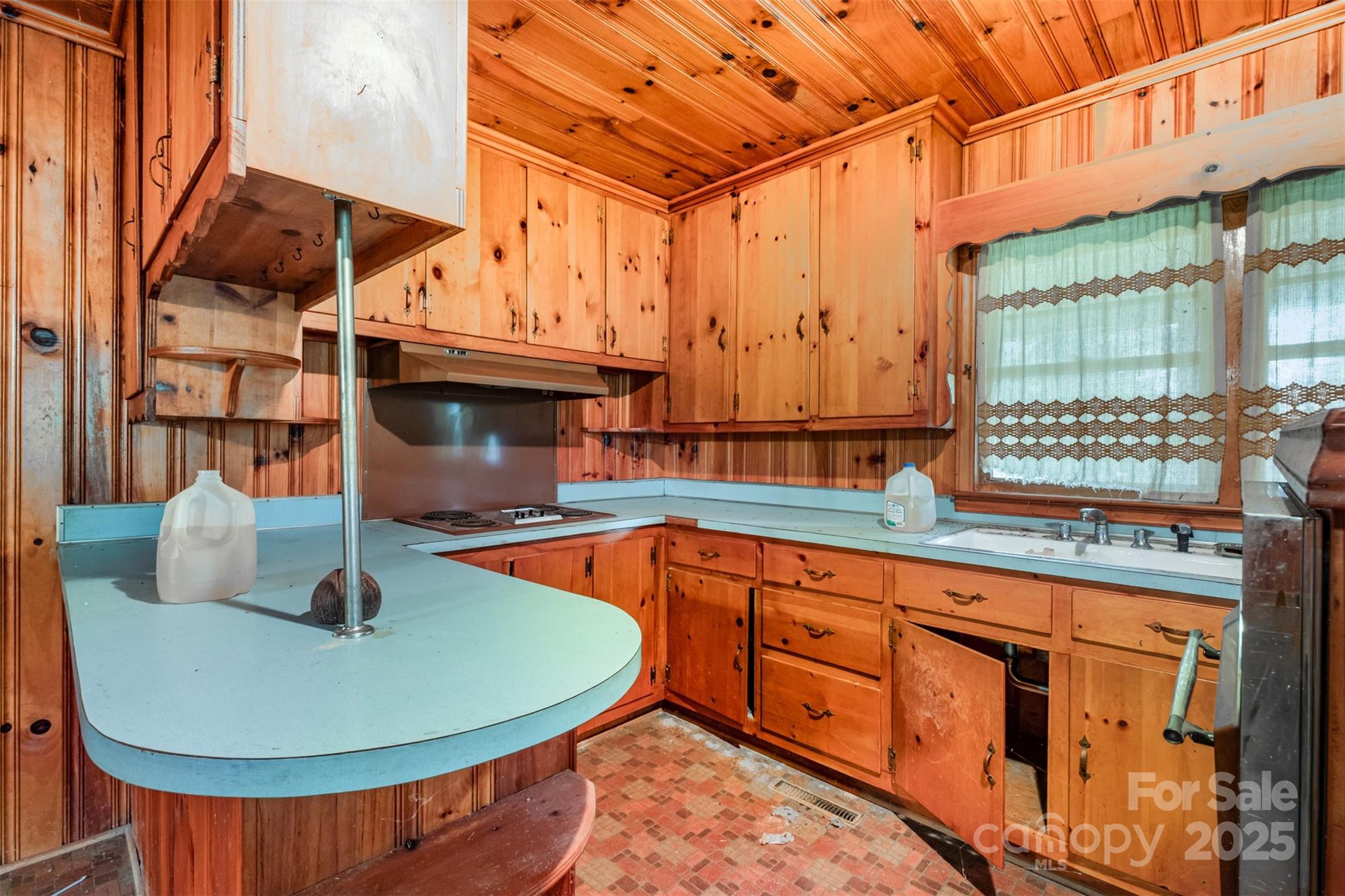 2412 Daves Road Shelby, NC 28150 - Photo 17 of 38 a view of a kitchen with kitchen island a sink and wooden floors