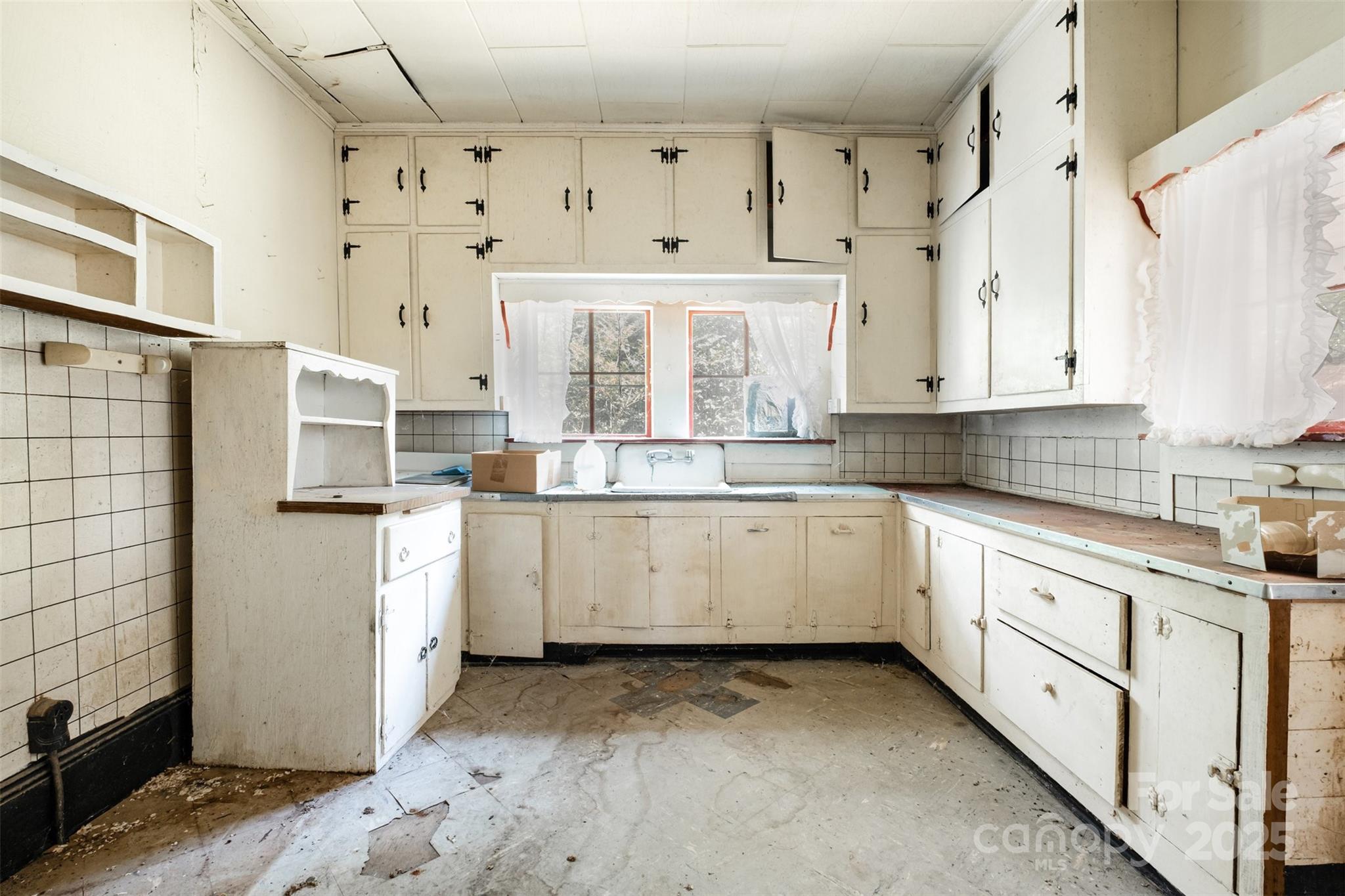 2412 Daves Road Shelby, NC 28150 - Photo 18 of 38 a kitchen with granite countertop white cabinets white stainless steel appliances with a sink and dishwasher