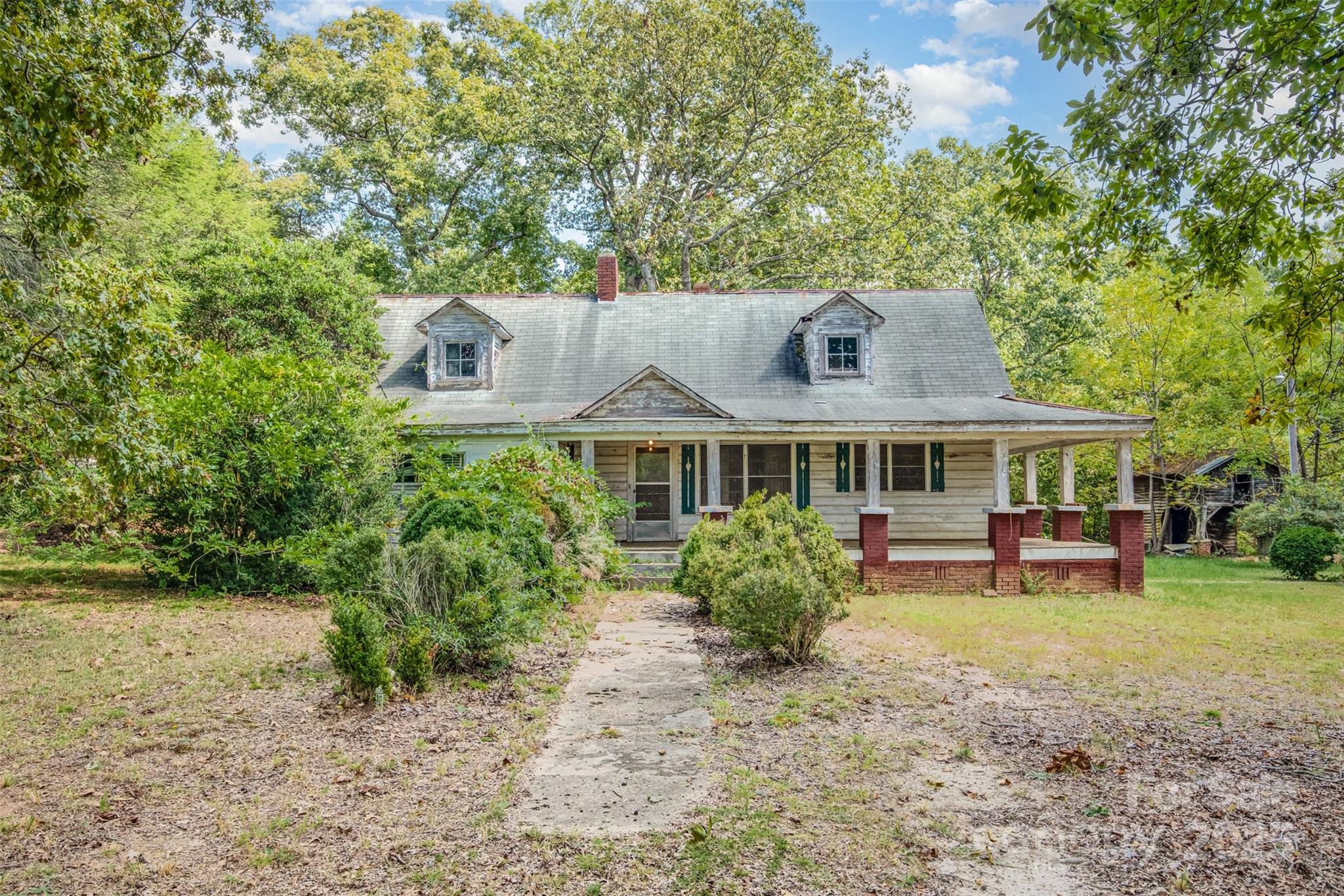 2412 Daves Road Shelby, NC 28150 - Photo 2 of 38 a front view of a house with a garden