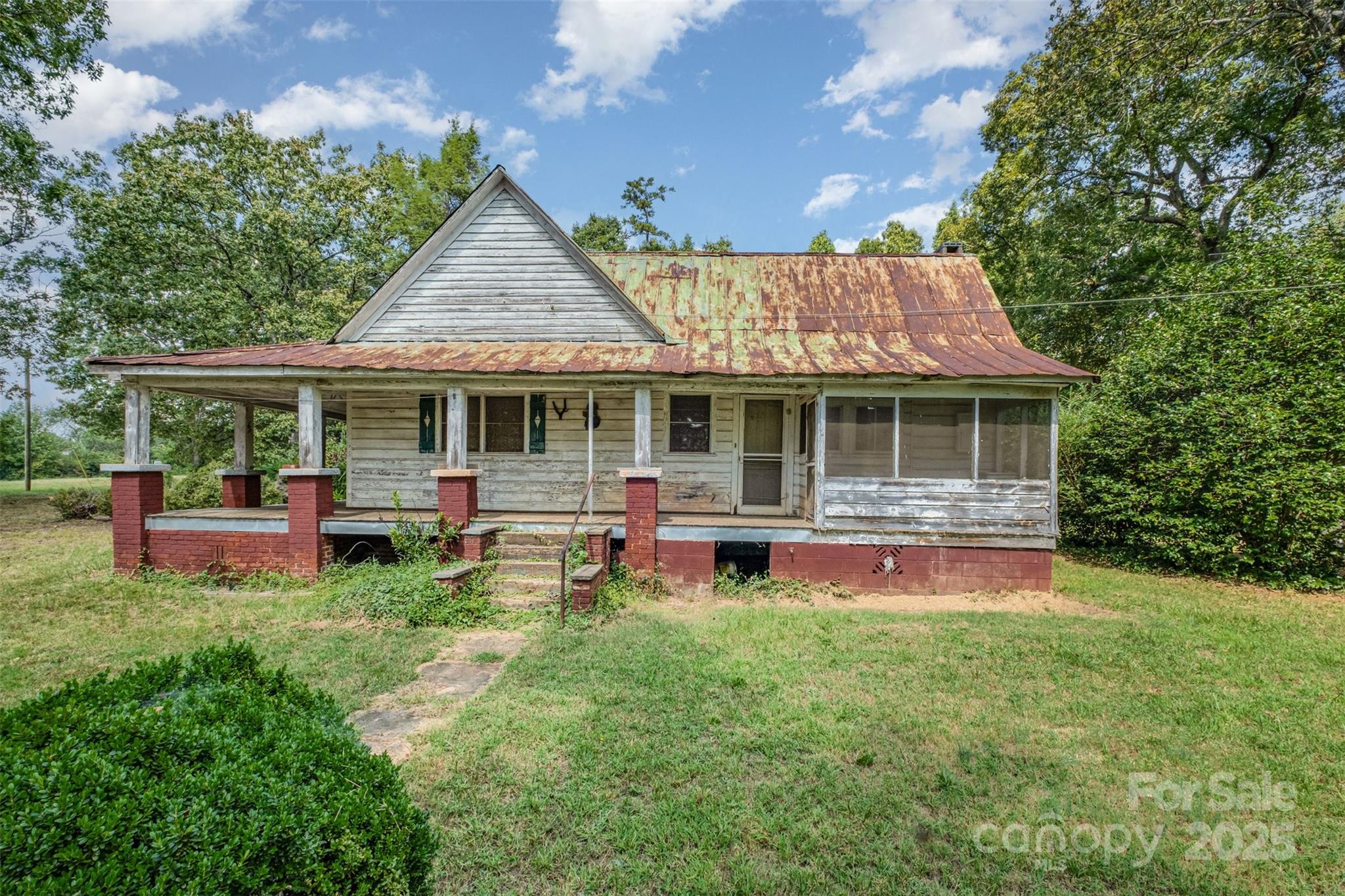 2412 Daves Road Shelby, NC 28150 - Photo 27 of 38 a front view of a house with table and chairs