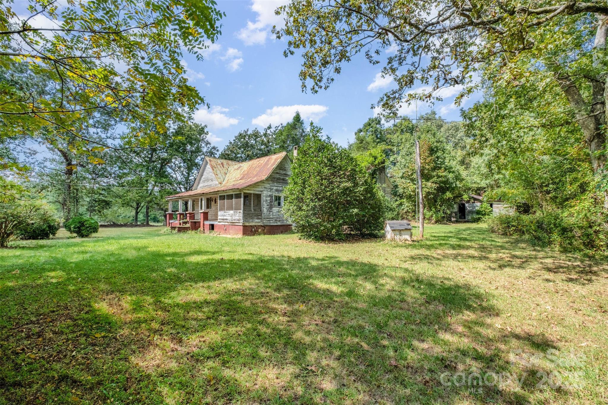2412 Daves Road Shelby, NC 28150 - Photo 30 of 38 a view of a big yard with plants and large trees