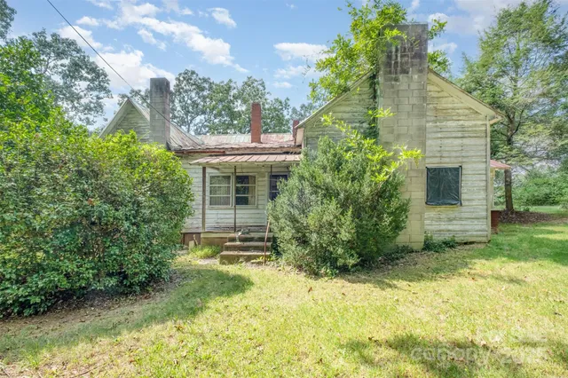 a view of a park with large trees