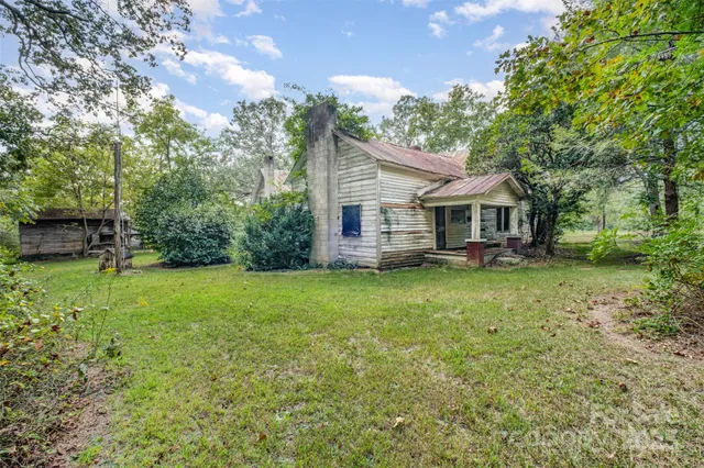 a view of a yard with trees