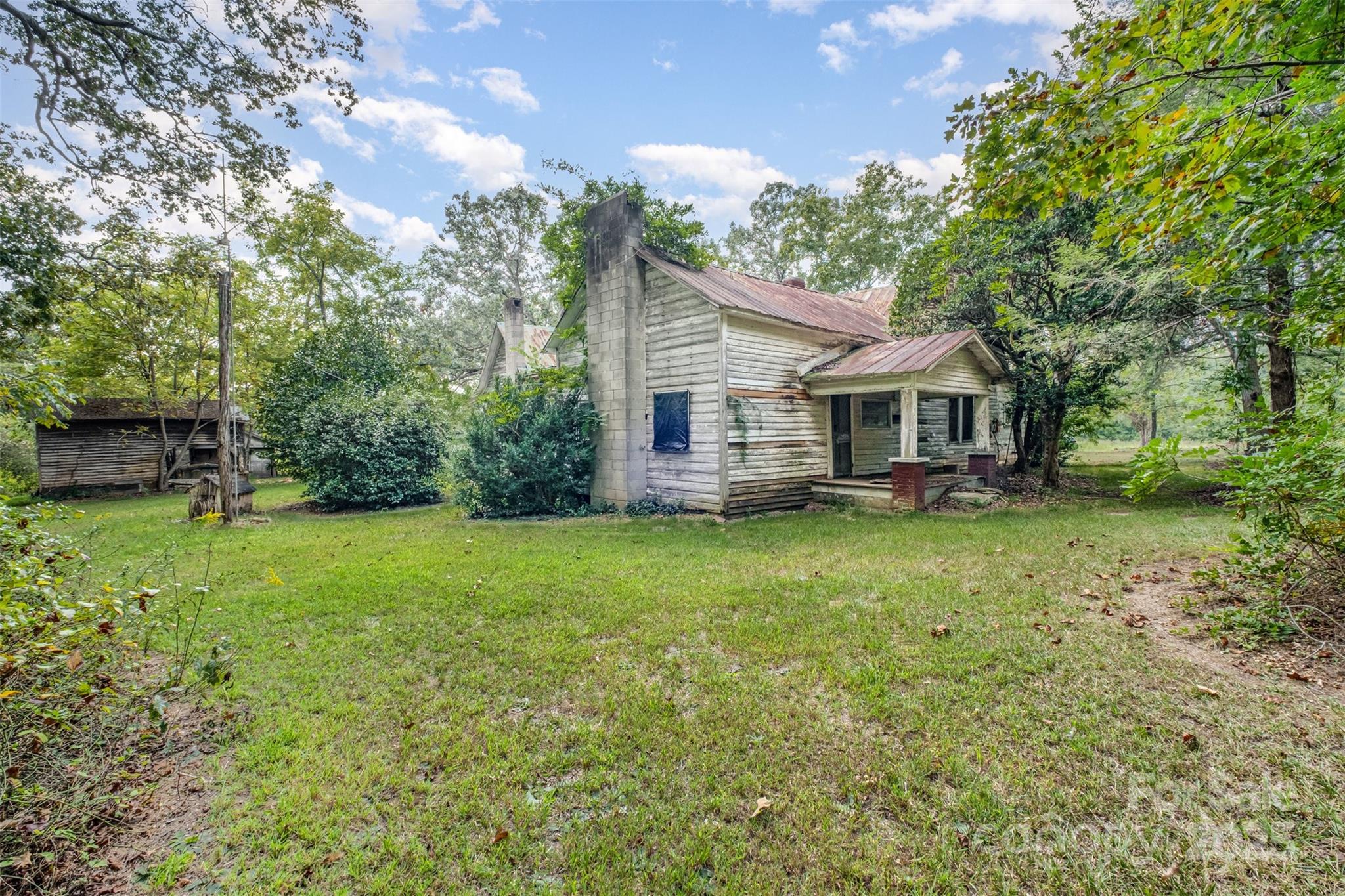 2412 Daves Road Shelby, NC 28150 - Photo 32 of 38 a view of a house with backyard and sitting area