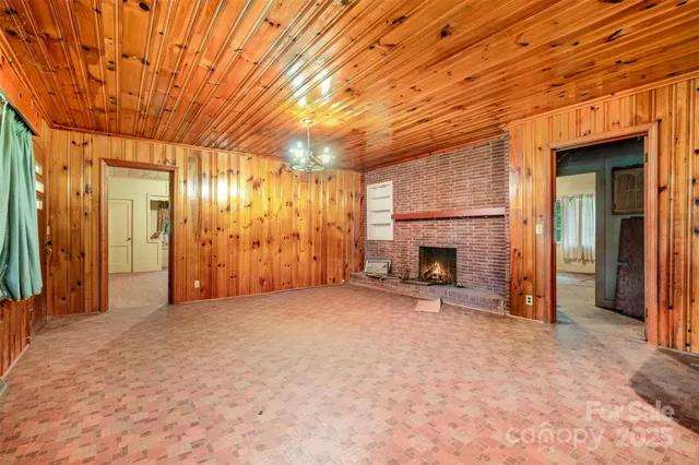 a view of a room with furniture and a kitchen