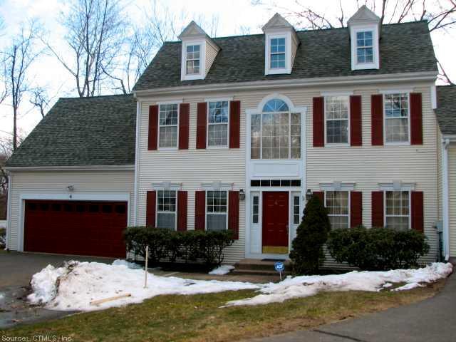 4 Whitward Place, Unit 4 Windsor, CT 06095 - Photo 1 of 1 a front view of a house with a yard