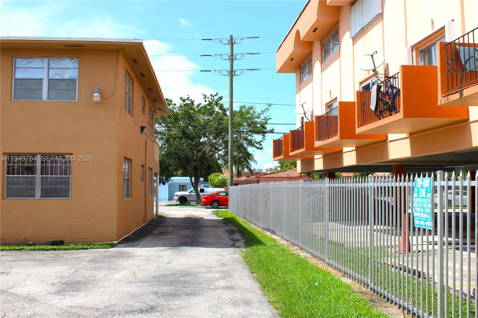 1154 West 35th Street, Unit 221 Hialeah, FL 33012 - Photo 11 of 39 a view of a street with brick building in front of it
