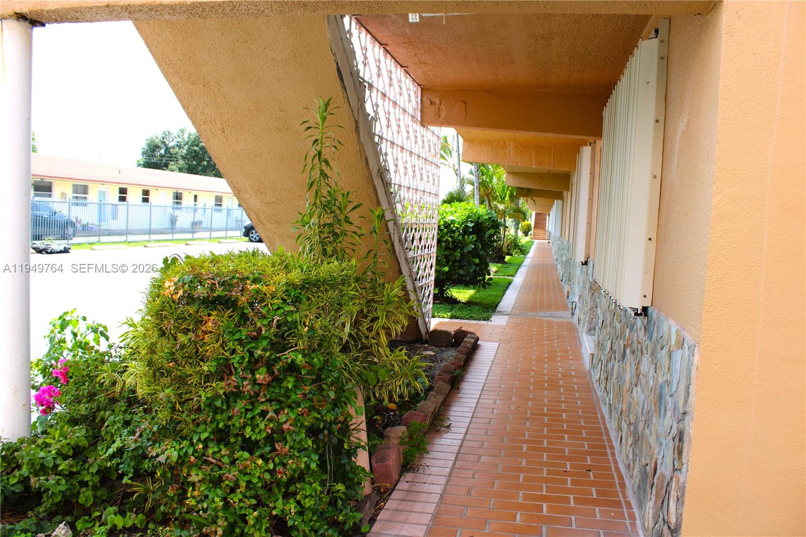 1154 West 35th Street, Unit 221 Hialeah, FL 33012 - Photo 13 of 39 a view of a potted flower in front of a door