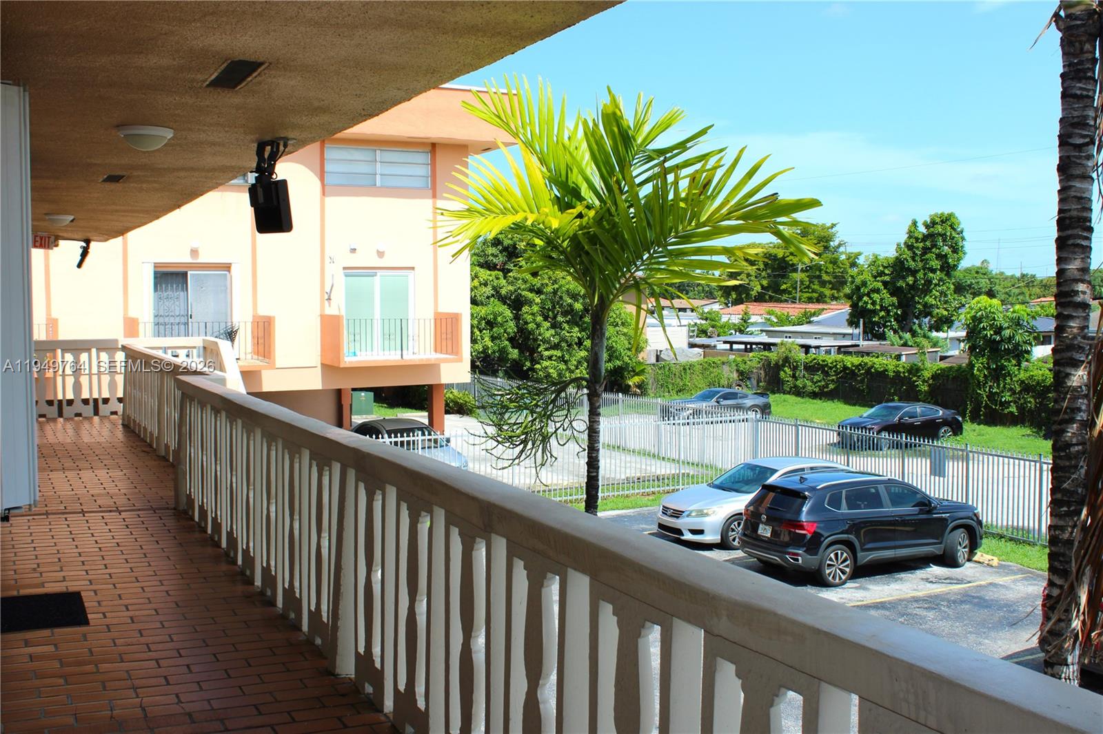 1154 West 35th Street, Unit 221 Hialeah, FL 33012 - Photo 18 of 39 a view of a car park from a balcony