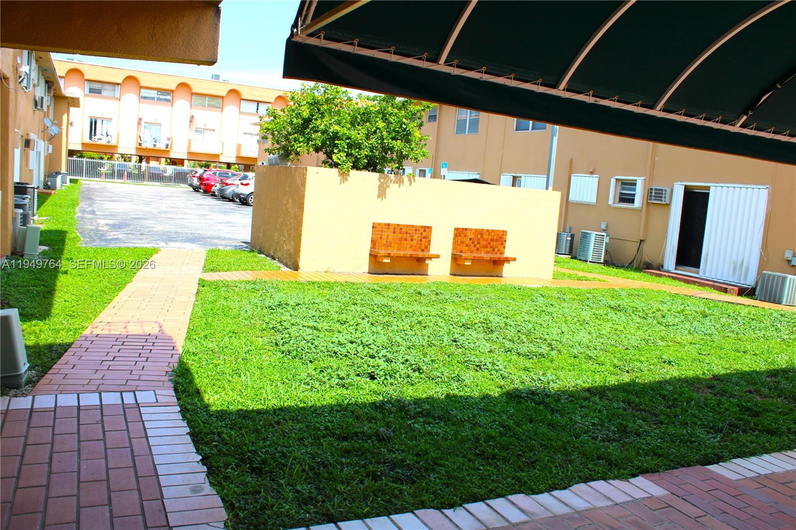 1154 West 35th Street, Unit 221 Hialeah, FL 33012 - Photo 32 of 39 a view of a backyard with a garden