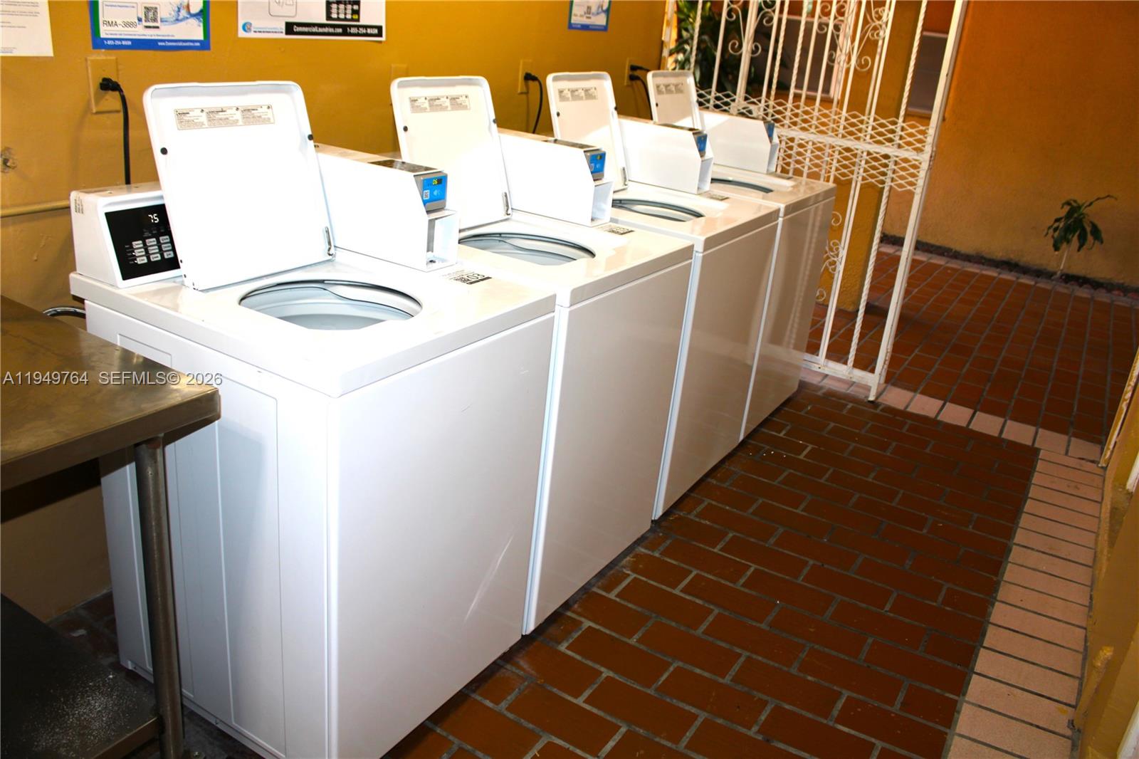 1154 West 35th Street, Unit 221 Hialeah, FL 33012 - Photo 38 of 39 a utility room with dryer and washer