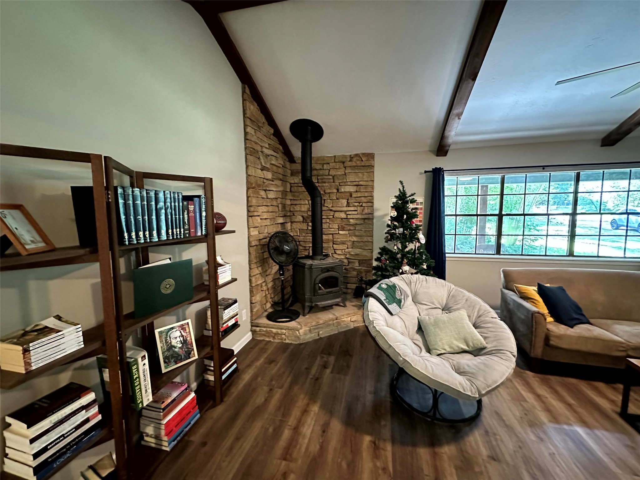 12289 Thompson Road Willis, TX 77318 - Photo 5 of 20 Wood-burning stove accents this living room.