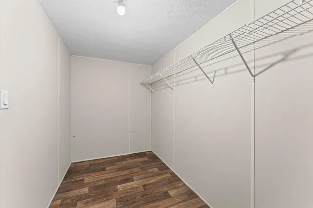 a bedroom with bed and window