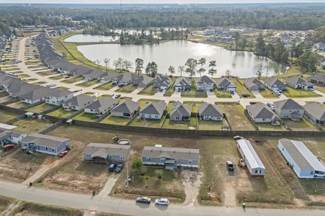 an aerial view of residential houses with outdoor space