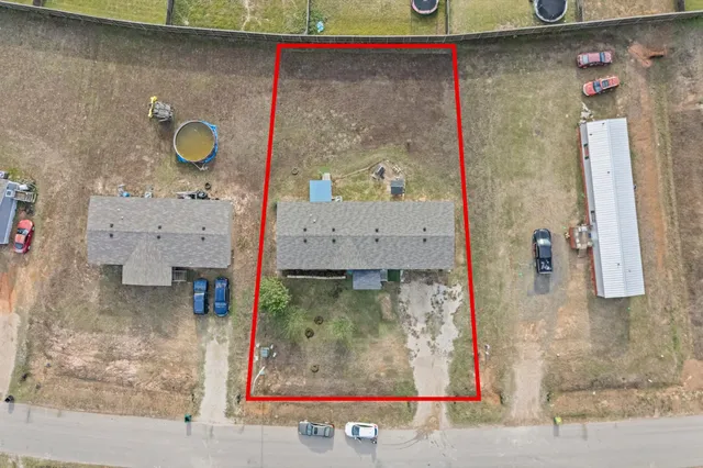 an aerial view of a house with a lake view